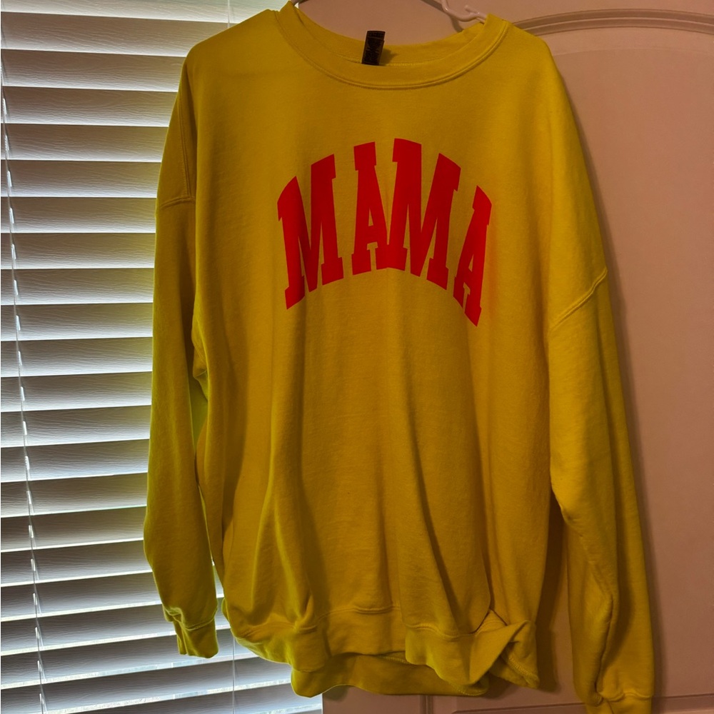 Neon yellow sweatshirt with “mama” in neon pink
